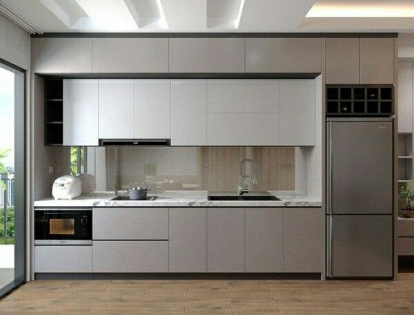 Mẫu tủ bếp đơn sắc với thiết kế tối giản, tạo cảm giác tinh tế và sang trọng cho không gian bếp.